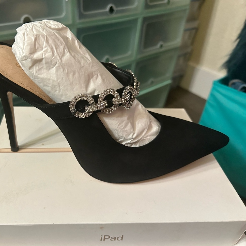 Black suede like open back closed toe pump.